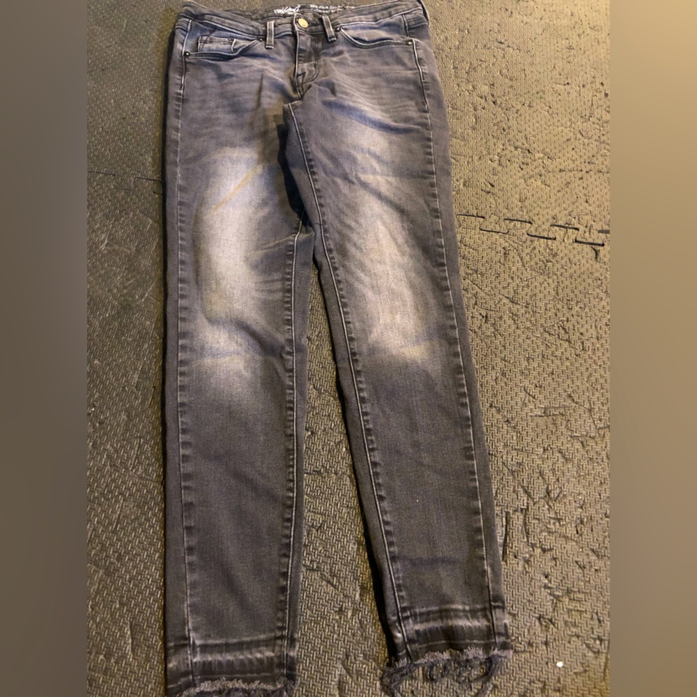 Mid rise distressed denim with stretch